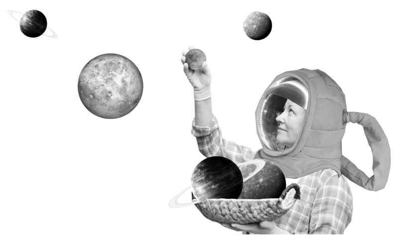 Eine Person in einem Raumfahrtanzug und mehrere Planeten, die in einer Schale gesammelt werden