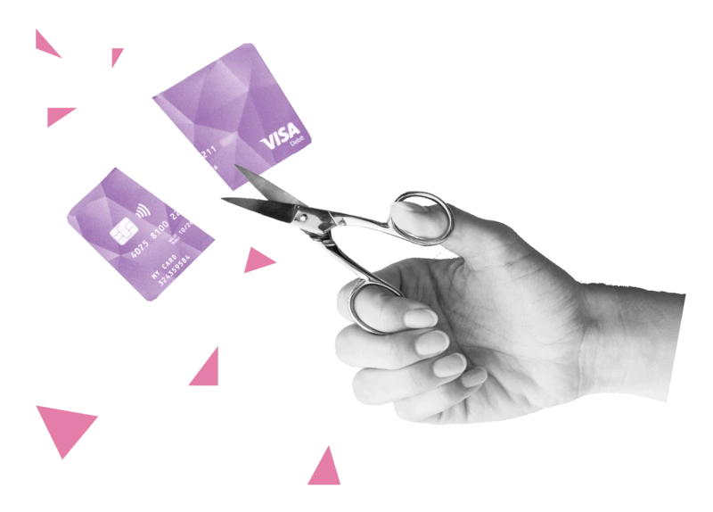Eine Nagelschere durchschneidet eine Bezahlkarte für Geflüchtete